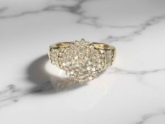 A 9ct gold diamond cluster ring, the stated total diamond weight 1.