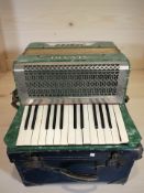 An Alvari piano accordion in box.