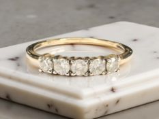 A 9ct gold five stone diamond ring, total diamond weight 0.