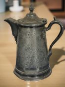 A large early 19th century pewter tankard, height 33 cm.