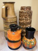 A West German pottery jug, height 46 cm, and three further vases / jugs.