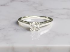 A platinum brilliant cut diamond solitaire, approximately 0.4ct, size O.