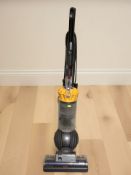 A Dyson DC40 upright vacuum cleaner.