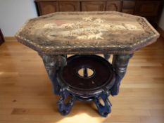 An Indian carved hardwood and inlaid coffee table on elephant supports, width 68 cm,