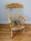 A pine spindle back farmhouse armchair.
