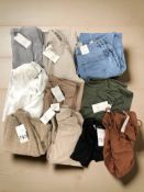 A group of women's Zara clothing including wide leg denim jeans, several woolen jumpers and tops,