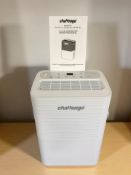 A Challenge dehumidifier with manual and lead.