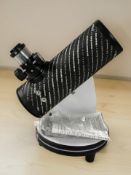 A Celestron First Scope telescope, with instructions.