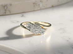 A 9ct gold and platinum ring set with a small diamond, size M CONDITION REPORT: 1.