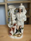 A Victorian Staffordshire figure of a highlander with dog, height 39 cm.