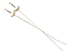 A pair of fencing foils.