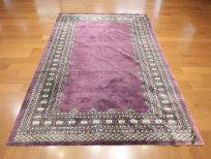 A Lahore Bokhara rug, Pakistan, 244 cm x 160 cm.