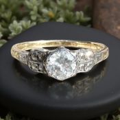 An Art Deco gold and platinum diamond solitaire ring, approximately 0.