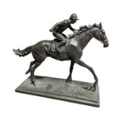 A resin figure of a jockey on horseback,