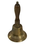 A brass school bell, height 24 cm.