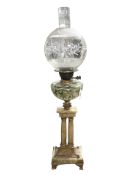 A classical-style oil lamp with hand-painted glass reservoir (cracked) and etched clear glass shade,