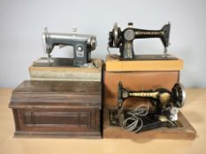 A Singer sewing machine, Jones and a Universal sewing machine, all three boxed.