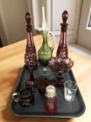 A pair of etched ruby glass decanters and stoppers and a similar goblet, tazza,