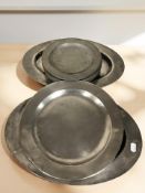 A group of 18th century pewter plates, largest 40 cm wide.