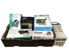 A group of boxed tools including LCD solder station, UK to US voltage converter,