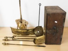 A 19th century wooden box containing a brass fire front companion set, carpet beater, etc.