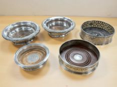 A group of decanter and bottles stands, two silver, one of Masonic interest,