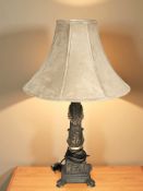 A reproduction gilt composition classical style table lamp with suede shade, height 80 cm.