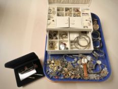 A contemporary jewellery box and contents to include various silver and white metal items,