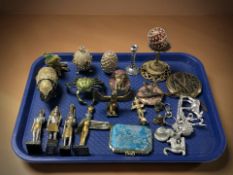 A collection of decorative objects, figures, compact,