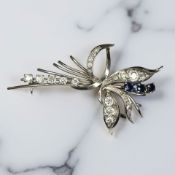 An 18ct white gold sapphire and diamond brooch, total diamond weight approximately 1.