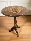 An early 20th century mahogany chessboard tripod table, height 71 cm.