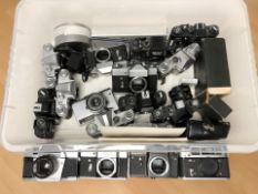 A collection of Soviet cameras including Zenit, Zorki, some with lenses.