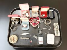 A group of costume jewellery, cuff links, several lighters including Zippo,