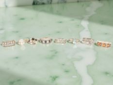 Eight silver/white metal gem-set dress rings, some stamped 925.