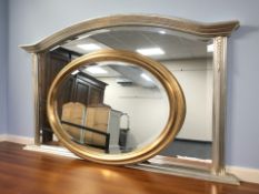 A contemporary silvered over mantel mirror, width 125 cm, together with an oval gilt mirror.
