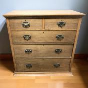 An Edwardian Art Nouveau oak five drawer chest, 107 cm x 51 cm x 110 cm.