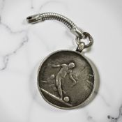 A silver medallion inscribed 'Football, 3rd Tyneside Scottish, William Elsender, France 1917.