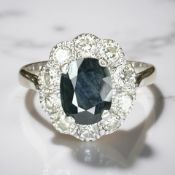An antique 18ct white gold and sapphire and diamond cluster ring,