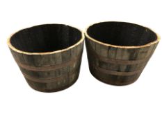 A pair of coopered barrel planters,