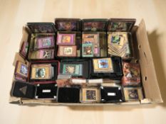 A large quantity of Yu-Gi-Oh! trading cards in tins.