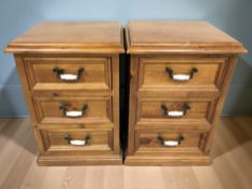 A pair of modern pine three drawer bedside chests, 50 cm W x 45 cm D x 72 cm H.