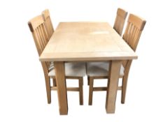 A contemporary pine effect rectangular dining table, 135 cm x 80 cm x 78 cm,
