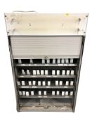 An enamelled metal shutter front filing cabinet,