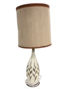 A ceramic table lamp with shade,