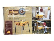 A Triton saw table in box