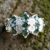 A 14ct white gold colour-treated blue diamond and white diamond ring,