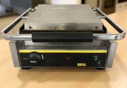 A Buffalo stainless steel commercial grill.