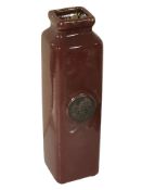 An oriental sang de boeuf square section pottery vase, height 31 cm.