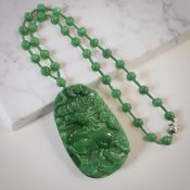 A jade pendant on bead necklace, pendant 9.
