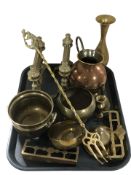Brass and copper wares including a pair of fire dogs, trivets,